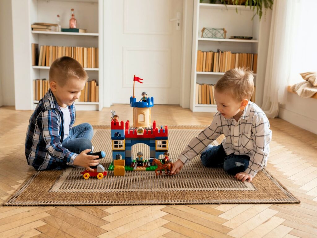 Two kids building lego blocks at Copenhagen in winter