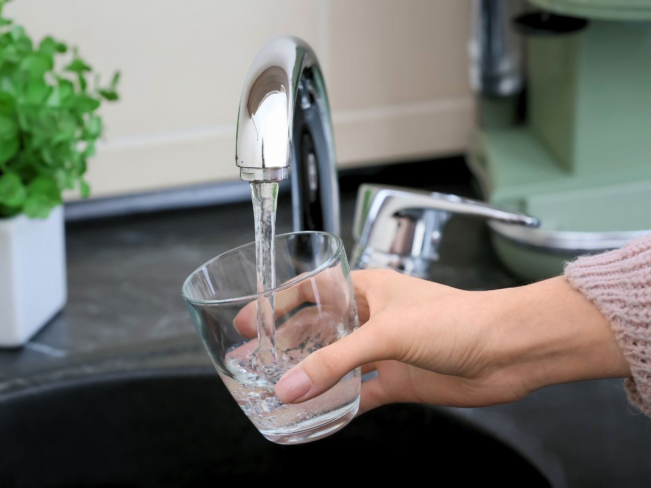 Is it safe to drink tap water in Denmark? - Filling tap water from a tumbler