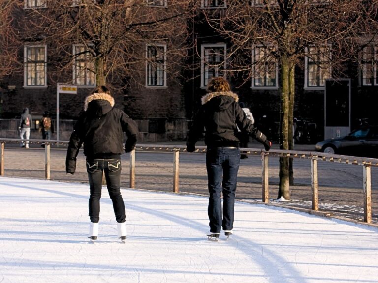 A couple ice skating in Copenhagen at Kongens Nytorv