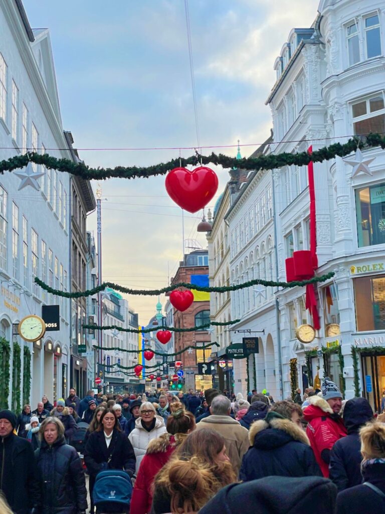 People walking on the busy decorated streets while on Copenhagen Christmas Tours