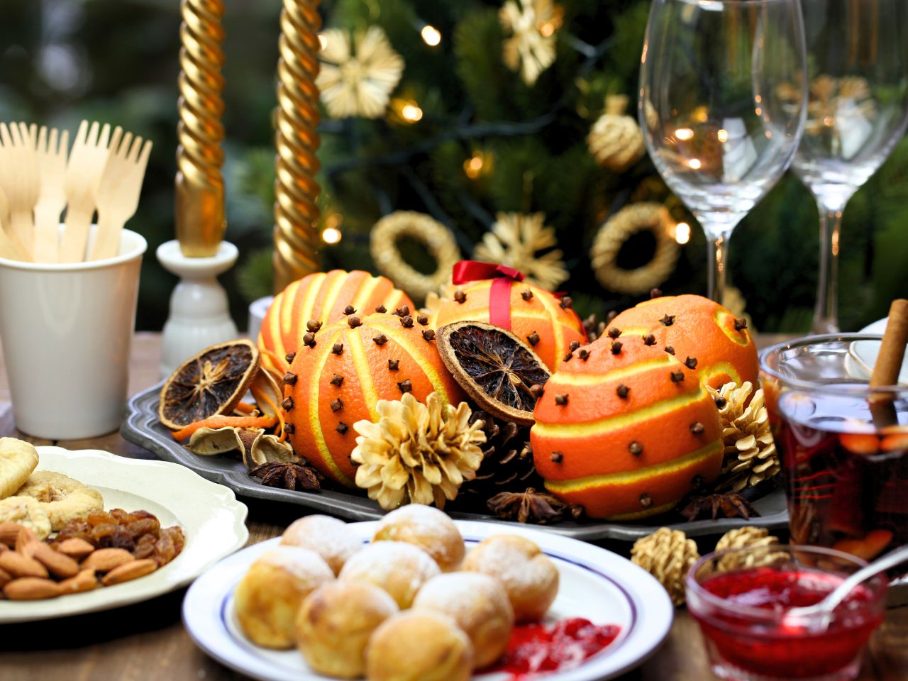 Best Danish Christmas food and drinks - Æbleskiver, Danish Christmas cookies, Gløgg and oranges spread in plates.