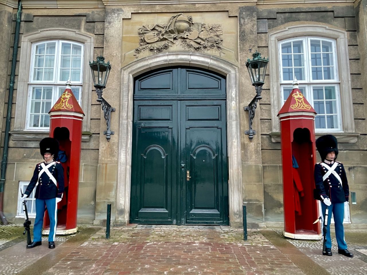 Guards standing at red guard box at Amalienborg palace, Copenhagen