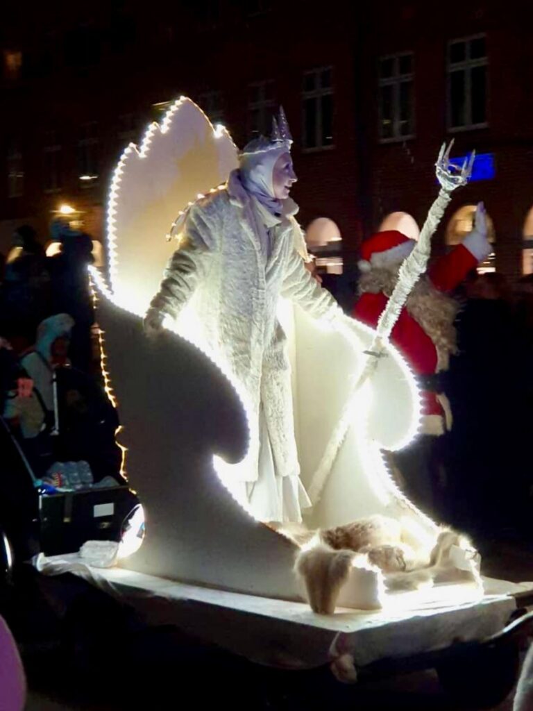 Snow woman sitting on the throne - people marching on the Denmark's largest parade