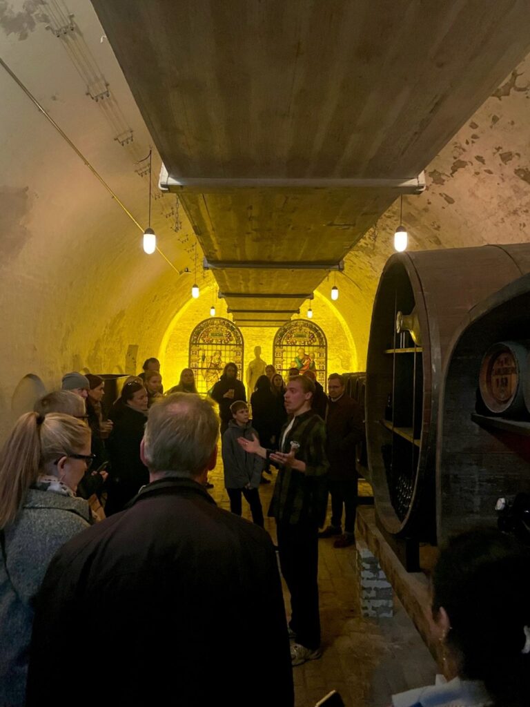 Home of Carlsberg brewer tour - A Carlsberg staff explaining in their cellars