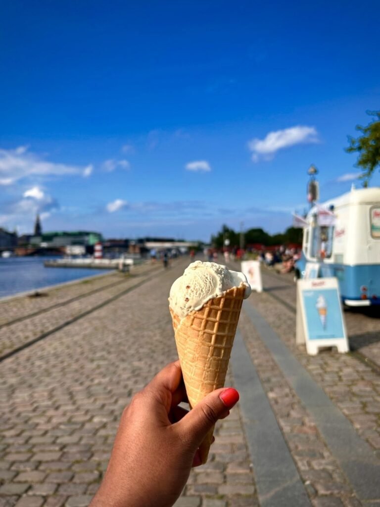 Eating icecream near harbour baths and beaches of Copenhagen