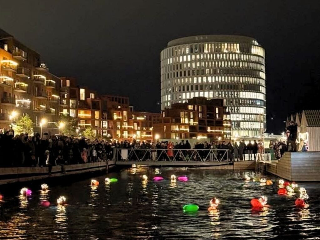 Swimmers swimming on ice cold waters during Santa Lucia day at Nordhavn Copenhagen Canals