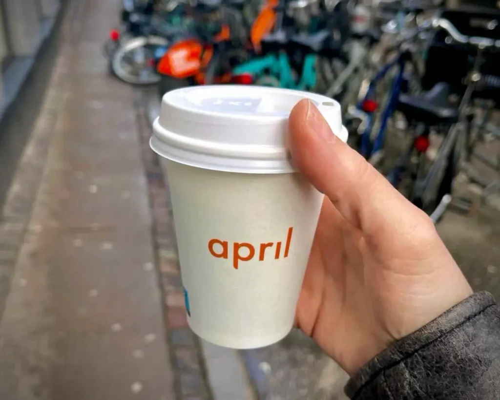 Holding a cup of April coffee on the streets of Copenhagen