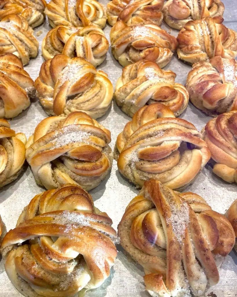 Several Cardamom buns pastry kept on a tray