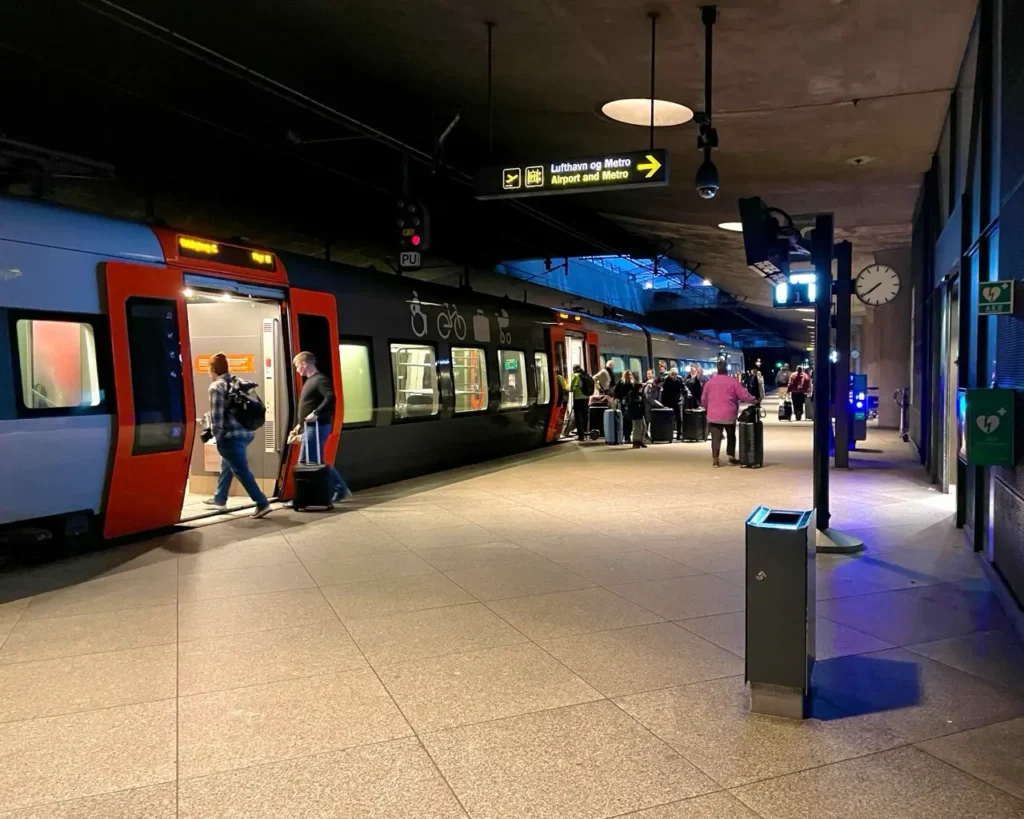 People boarding a metro train from Copenhagen airport train station