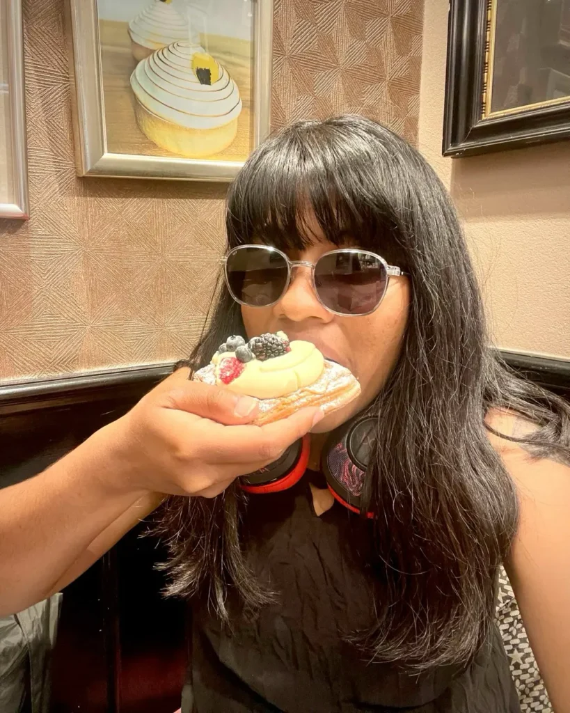 Agalya eating a Danish pastry