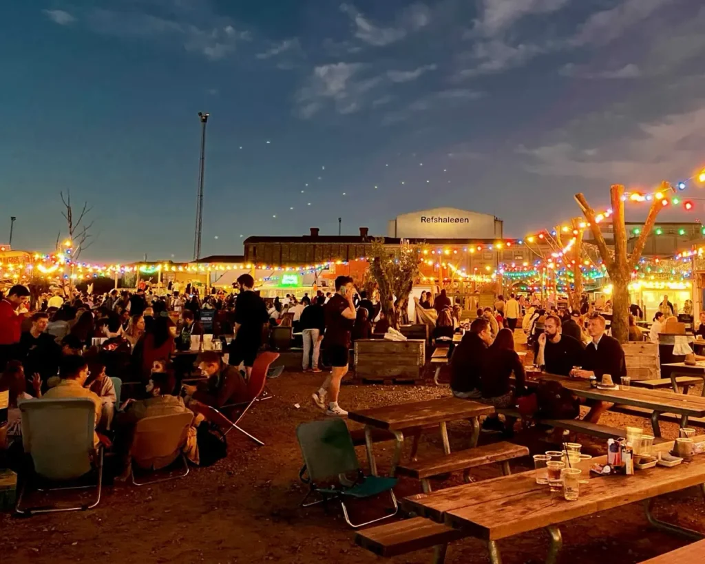 People enjoying the night life at Copenhagen by visiting Street food market at night