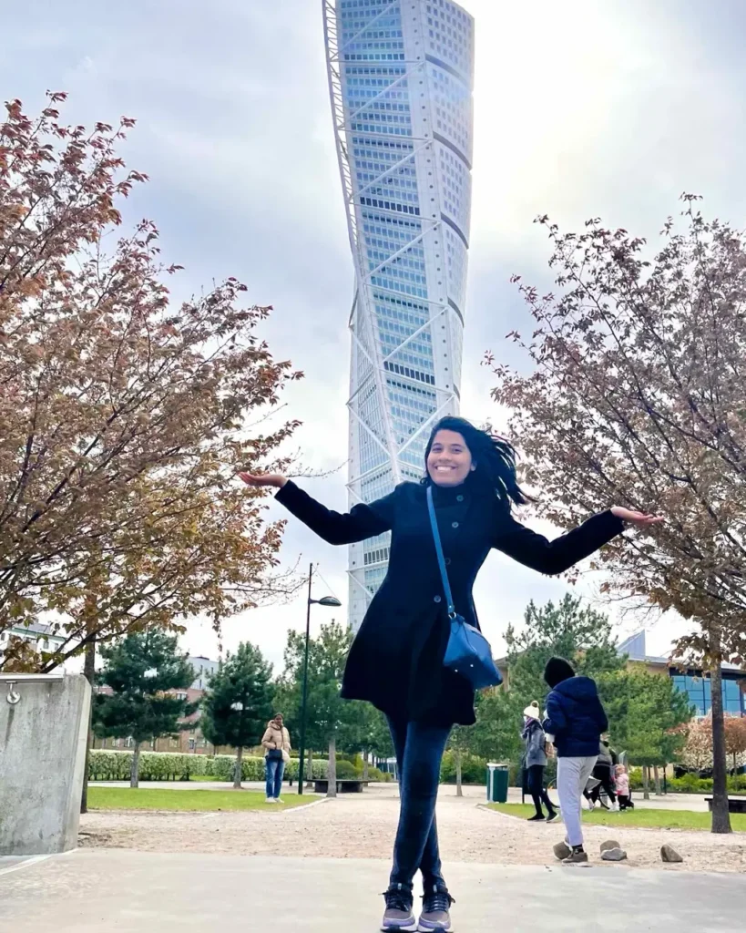 Agalya standing in front of Turning Torso Malmo